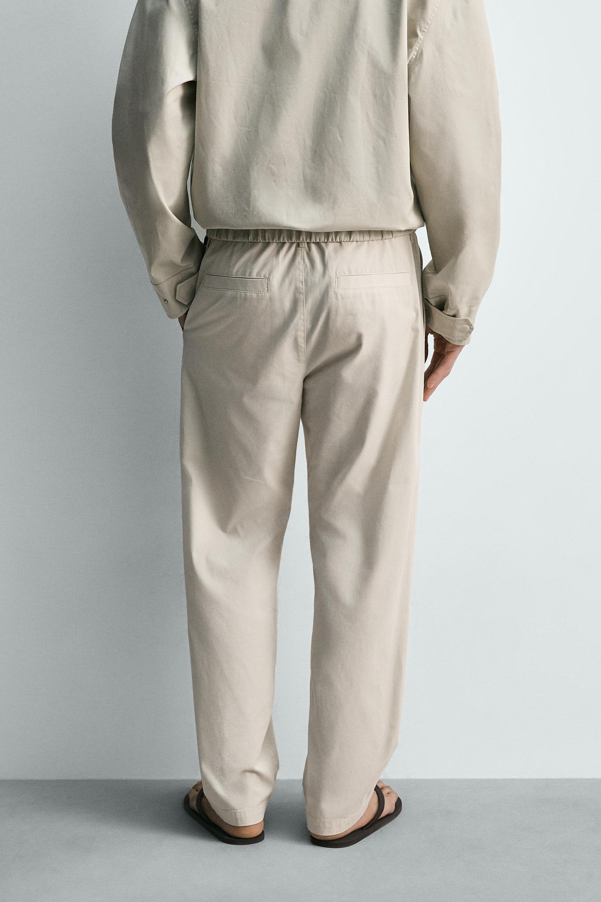 PLEATED STRAIGHT FIT PANTS